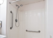 Thumbnail 19 of 21 - a bathroom with a shower and a sink