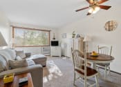 Thumbnail 15 of 23 - the living room and dining room with a couch and a table