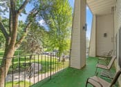 Thumbnail 4 of 23 - the retreat at thousand oaks apartments patio with chairs and grass