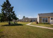Thumbnail 8 of 19 - a row of houses in a yard with a sidewalk