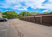 Thumbnail 28 of 28 - a large parking lot with cars parked in front of a building