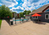 Thumbnail 18 of 28 - our apartments have a large patio with a pool and table