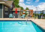 Thumbnail 19 of 28 - our apartments have a swimming pool and a patio with chairs
