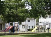 Thumbnail 4 of 6 - a playground with a bunch of slides in a park