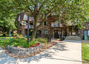 Thumbnail 2 of 19 - the front of a house with a sidewalk and trees