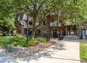 Thumbnail 4 of 19 - the front of a house with a sidewalk and trees