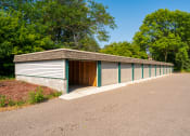 Thumbnail 19 of 19 - a row of garages in a parking lot