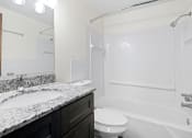 Thumbnail 18 of 20 - a bathroom with a sink and a toilet and a shower