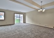 Thumbnail 5 of 7 - A room with a carpeted floor and a ceiling light.