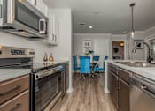 Thumbnail 32 of 34 - Kitchen with Stainless Steel Appliances  at Oxbow Hill Country, Texas, 78006
