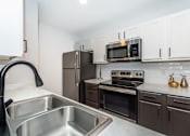 Thumbnail 16 of 34 - Kitchen with Sink at Oxbow Hill Country, Boerne