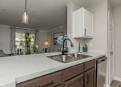 Thumbnail 31 of 34 - Modern Kitchen with Sink at Oxbow Hill Country, Boerne, Texas
