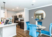 Thumbnail 14 of 34 - Kitchen with White Counter at Oxbow Hill Country, Boerne, TX