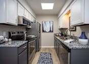 Thumbnail 1 of 80 - A kitchen with a refrigerator, oven, and microwave.at Addison at Sutherland, Knoxville, 37909  