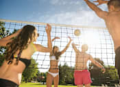 Thumbnail 72 of 80 - Four people playing volleyball on a sunny day.at Addison at Sutherland, Knoxville, TN 37909  