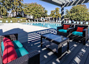 Thumbnail 73 of 80 - A poolside area with two black wicker chairs and a table.at Addison at Sutherland, Tennessee, 37909