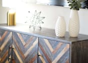 Thumbnail 16 of 80 - A wooden cabinet with a chevron pattern and two vases on top.at Addison at Sutherland, Knoxville, TN 37909  