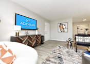 Thumbnail 24 of 80 - Living Room With TV at Addison at Sutherland, Tennessee