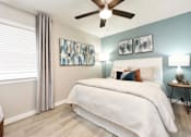 Thumbnail 37 of 80 - A bedroom with a large bed and a ceiling fan.at Addison at Sutherland, Tennessee  