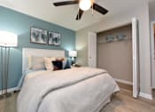 Thumbnail 38 of 80 - A bedroom with a large bed and a ceiling fan.at Addison at Sutherland, Tennessee, 37909