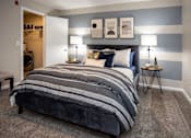 Thumbnail 40 of 80 - A bedroom with a large bed and two nightstands with lamps.at Addison at Sutherland, Tennessee, 37909