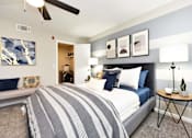 Thumbnail 52 of 80 - A bedroom with a large bed and a ceiling fan.at Addison at Sutherland, Knoxville  
