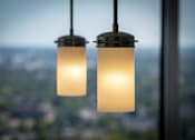 Thumbnail 12 of 34 - two lights hanging in front of a window