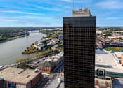 Thumbnail 30 of 34 - an aerial view of a tall building next to a river