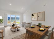 Thumbnail 10 of 23 - A modern dining room with a wooden table set for four.