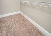 Thumbnail 17 of 23 - Empty room with a carpeted floor and a white wall.