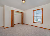 Thumbnail 13 of 14 - A room with a window and a door.