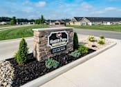 Thumbnail 1 of 23 - A sign for Horizon Point Village stands in front of a grassy area.
