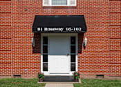 Thumbnail 14 of 16 - A red brick building with a black awning that reads 91 Rossway 95-102.