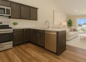Thumbnail 6 of 23 - A modern kitchen with dark brown cabinets and a white brick backsplash.