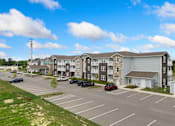 Thumbnail 60 of 62 - an empty parking lot in front of an apartment building at 41 North Apartments, Fort Wayne, IN