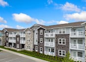 Thumbnail 62 of 62 - an exterior view of an apartment building on a street at 41 North Senior Living Apartments, Fort Wayne
