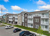 Thumbnail 52 of 62 - an aerial view of an apartment complex with cars in a parking lot at 41 North Apartments, Fort Wayne, IN 46835