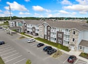 Thumbnail 56 of 62 - an aerial view of an apartment complex with cars parked in a parking lot at 41 North Apartments, Fort Wayne