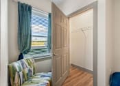 Thumbnail 8 of 62 - a bedroom with a window and a closet with a door at 41 North Apartments, Fort Wayne, IN