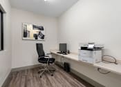 Thumbnail 22 of 62 - an office with a computer and a printer on a desk at 41 North Apartments, Fort Wayne Indiana