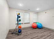 Thumbnail 40 of 62 - Fitness room with balls and exercise equipment at 41 North Apartments, Fort Wayne, IN 46835