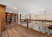 Thumbnail 18 of 62 - a living room with a staircase and a bookshelf at 41 North Apartments, Indiana