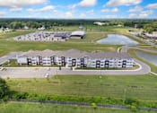 Thumbnail 54 of 62 - an aerial view of an apartment building next to a parking lot at 41 North Apartments, Fort Wayne, 46835
