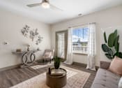 Thumbnail 35 of 62 - a living room with a couch and a chair and a window at 41 North Apartments, Fort Wayne, 46835
