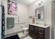 Thumbnail 4 of 62 - Bathroom with toilet sink and mirror at 41 North Apartments, Fort Wayne Indiana