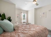 Thumbnail 53 of 62 - Bedroom with bed and window at 41 North Apartments, Fort Wayne, IN