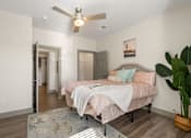 Thumbnail 42 of 62 - a bedroom with a large bed and a ceiling fan at 41 North Apartments, Fort Wayne Indiana