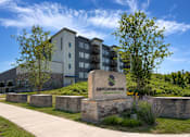 Thumbnail 18 of 19 - A building with a sign that says Switchyard Park in front of it.