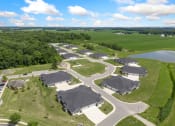 Thumbnail 28 of 43 - an aerial view of a neighborhood with houses and a pond at Morada at Maysville, Indiana, 46815