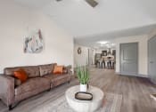 Thumbnail 10 of 43 - a living room with a couch and a coffee table at Morada at Maysville, Fort Wayne, 46815